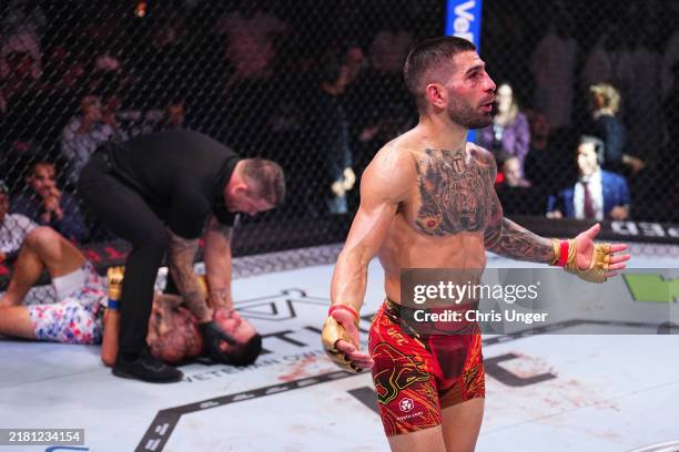 Ilia Topuria of Spain reacts after a knockout victory against Max Holloway in the UFC featherweight championship fight during the UFC 308 event at...