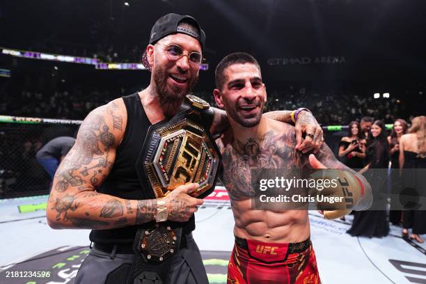 Ilia Topuria of Spain celebrates with Sergio Ramos after his knockout victory over Max Holloway in the UFC featherweight championship fight during...