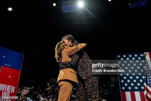 Democratic presidential nominee, U.S. Vice President Kamala Harris embraces former first lady Michelle Obama during a campaign rally at the Wings...
