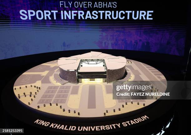 Picture taken on October 30, 2024 shows an artist illustration model of King Khalid University stadium in Abha in Saudi Arabia, during a media tour...
