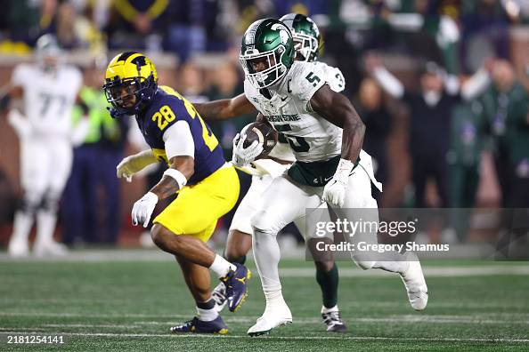 Java Carter Michigan Nate Carter of the Michigan State Spartans runs the ball during the ...