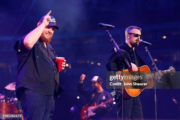 Luke Combs and Eric Church perform onstage at the Concert For Carolina Benefit Concert at Bank of America Stadium on October 26, 2024 in Charlotte,...
