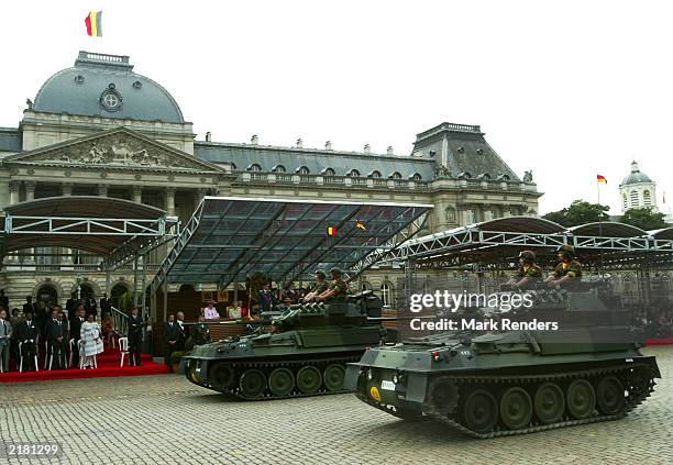 Light tanks pass in front of the Royal Palace during the military parade, part of National Day celebrations July 21, 2003 in Brussels, Belgium. Every...