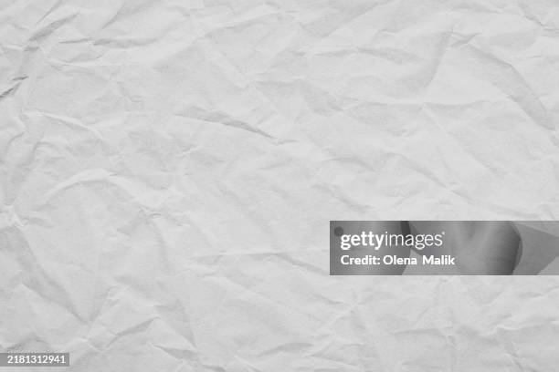 crumpled white paper texture background - arrugado fotografías e imágenes de stock