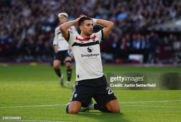 Diogo Dalot of Manchester United reacts after missing a chance during the Premier League match between West Ham United FC and Manchester United FC at...