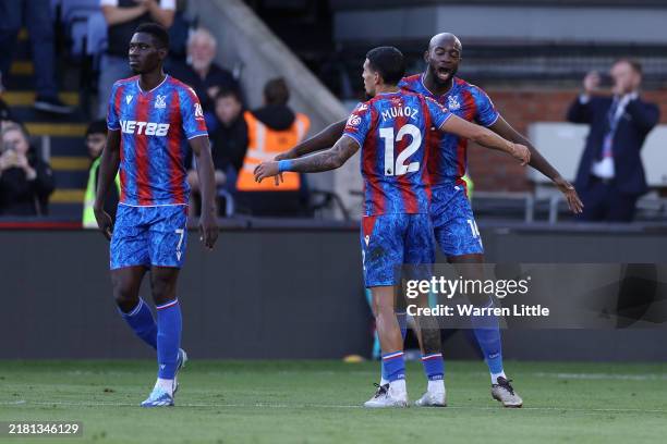 Jean-Philippe Mateta of Crystal Palace celebrates scoring his team's first goal with teammate Daniel Munoz during the Premier League match between...