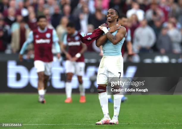 Crysencio Summerville of West Ham United celebrates scoring his team's first goal, after taking off his shirt, during the Premier League match...