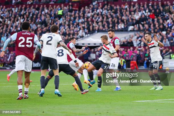 Danny Ings of West Ham United is fouled by Matthijs de Ligt of Manchester United resulting in a penalty kick during the Premier League match between...
