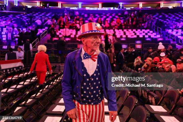 Man dressed as Uncle Sam arrives before Republican presidential nominee, former U.S. President Donald Trump speaks at a campaign rally at Madison...