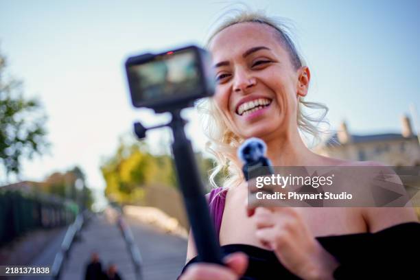 the essence of a travel influencer in action - digital camcorder stock pictures, royalty-free photos & images