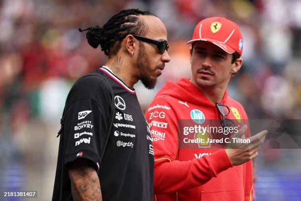 Lewis Hamilton of Great Britain and Mercedes and Charles Leclerc of Monaco and Ferrari talk during the drivers parade prior to the F1 Grand Prix of...