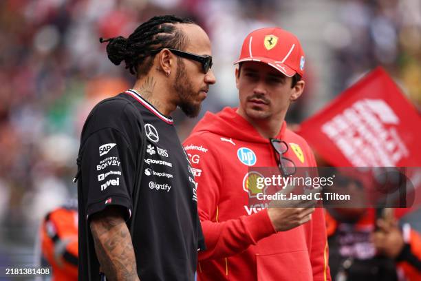 Lewis Hamilton of Great Britain and Mercedes and Charles Leclerc of Monaco and Ferrari talk during the drivers parade prior to the F1 Grand Prix of...
