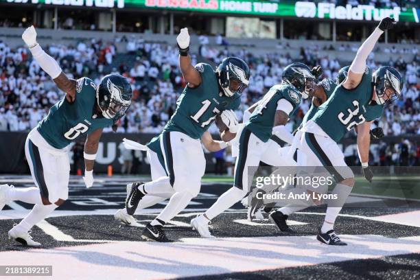 Nakobe Dean of the Philadelphia Eagles celebrates with teammates after recovering a fumble during the third quarter against the Cincinnati Bengals at...