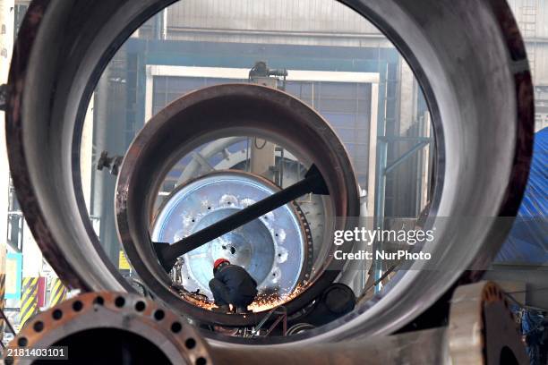 Construction worker builds petrochemical equipment at Lanshi Heavy Machinery Co LTD in Qingdao, China, on October 31, 2024.