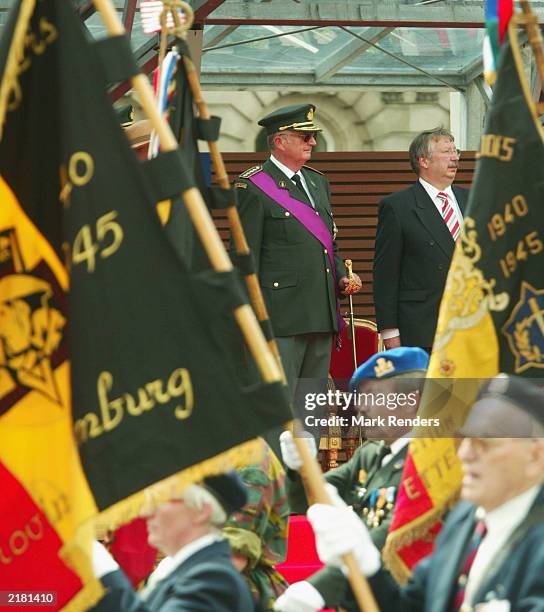 King Albert of Belgium and Belgian Minister of Defence Andre Flahaut watch the military parade, part of National Day celebrations July 21, 2003 in...