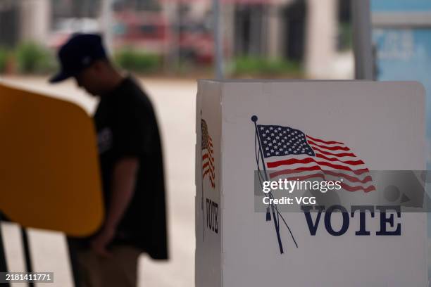 Voter casts ballot during the early voting process at a polling station ahead of the upcoming 2024 U.S. Presidential election on October 27, 2024 in...