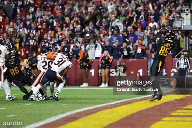 Noah Brown of the Washington Commanders catches a game winning touchdown pass against the Chicago Bears at Northwest Stadium on October 27, 2024 in...