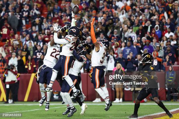 Noah Brown of the Washington Commanders looks on as a hail mary pass attempt against the Chicago Bears is tipped during the fourth quarter at...