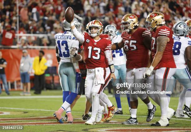 Brock Purdy of the San Francisco 49ers reacts after rushing for a touchdown during the third quarter against the Dallas Cowboys at Levi's Stadium on...
