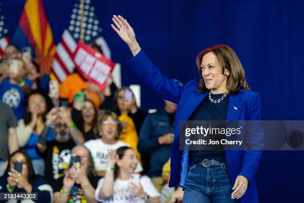 Democratic presidential nominee, U.S. Vice President Kamala Harris, waves to supporters while entering the stage during a campaign rally at Talking...