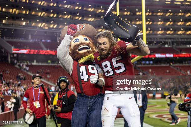 George Kittle of the San Francisco celebrates with Sourdough Sam following an NFL Football game against the Dallas Cowboys at Levi's Stadium on...