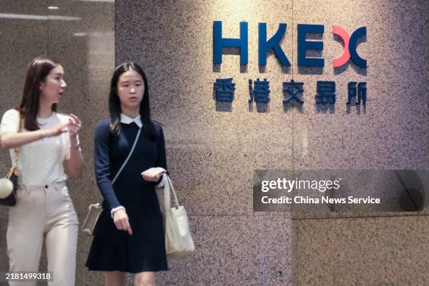 Pedestrians walk by the Hong Kong Stock Exchange on October 28, 2024 in Hong Kong, China. HKEX announced on Monday the launch of the HKEX Virtual...