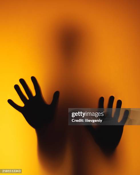 abstract silhouette - scary hand shadow stock pictures, royalty-free photos & images