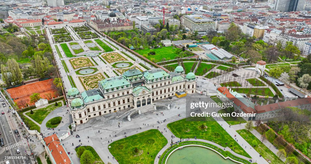 Aerial view of Belvedere Palace in Vienna, vienna city famous palace square aerial panorama, Belvedere Palace and its beautiful gardens, People walking in distance in Belvedere's Park
