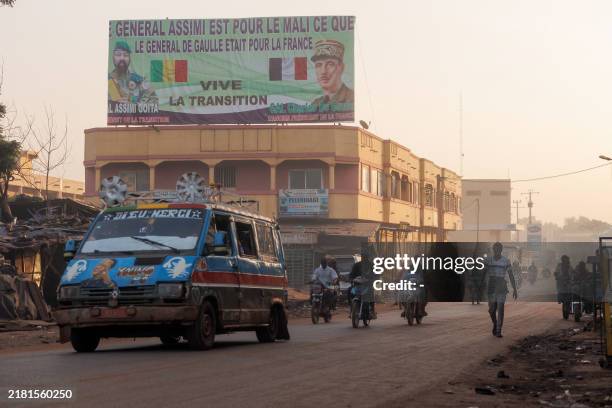 General view shows a billboard reading: "General Assimi is for Mali what General de Gaulle was for France" on a street in Bamako on November 1, 2024....