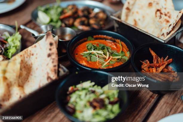 closeup of modern indian food on the dining table - culture of india stock pictures, royalty-free photos & images