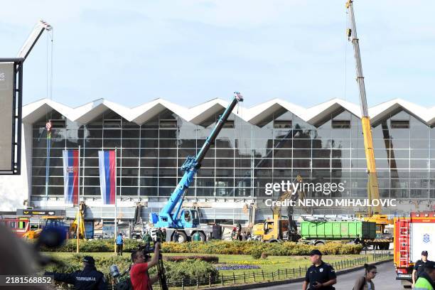 Emergency and rescue personnel work at the site where a concrete outdoor roof of a train station collapsed in the northern Serbian city of Novi Sad...