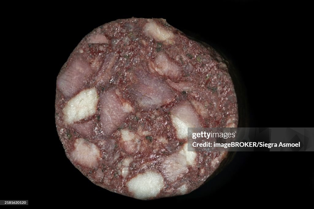 Cut Thuringian red sausage, blood sausage, studio photography with black background
