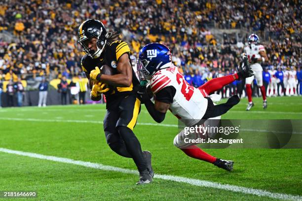 Calvin Austin III of the Pittsburgh Steelers scores a touchdown against Dru Phillips of the New York Giants during the fourth quarter at Acrisure...