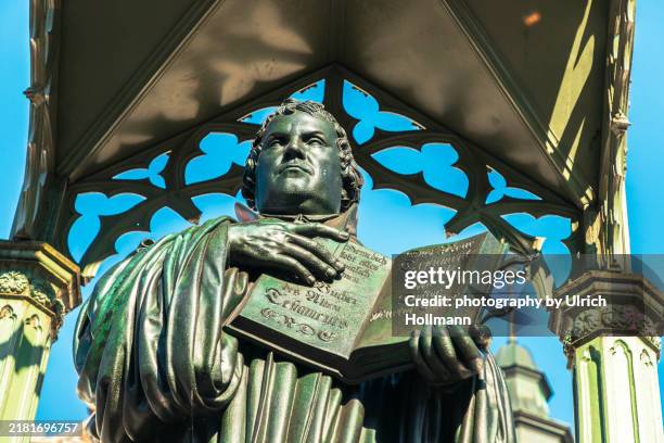 statue of martin luther in wittenberg, saxony-anhalt, germany - protestantism stock pictures, royalty-free photos & images