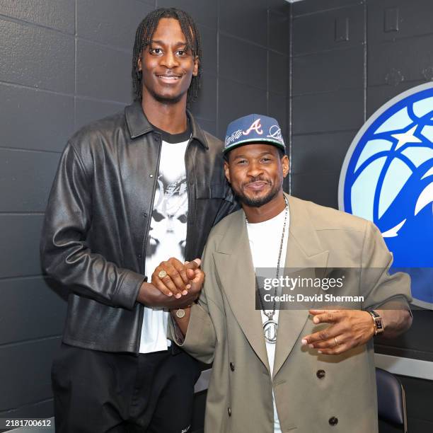 Leonard Miller of the Minnesota Timberwolves poses for a photograph with Usher after the game against the Denver Nuggets on November 1, 2024 at...