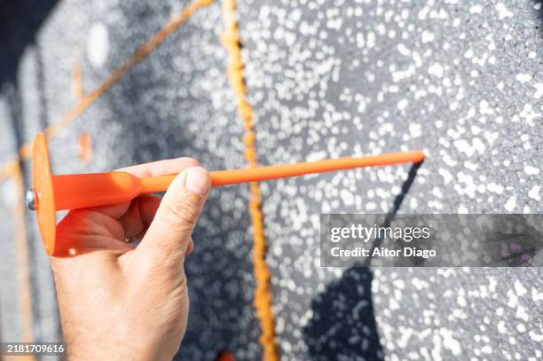 person doing thermal insulation with expanded polystyrene of a house façade. efficent house upgrades - polystyrene stock pictures, royalty-free photos & images