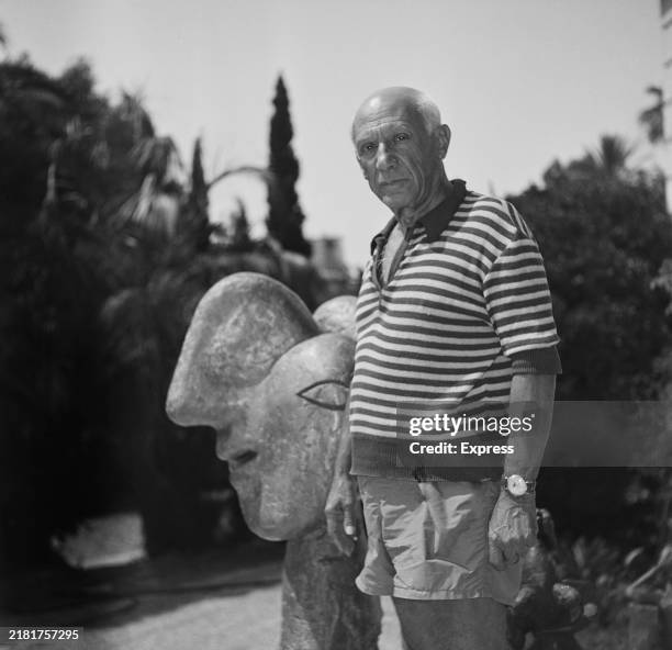 Spanish artist Pablo Picasso with one of his sculptures at Villa La Californie, his home in Cannes, France, 30th September 1955.