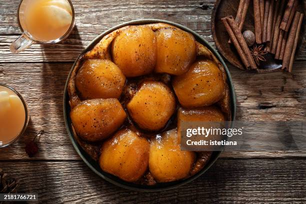apple tarte tatin and warm apple cider, autumnal dessert - tarte tatin stock-fotos und bilder