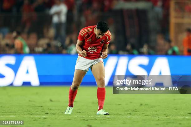 Akram Tawfik of Al Ahly celebrates after Abou Ali Wessam of Al Ahly scores his team's first goal during the match between Al Ahly and Al Ain during...