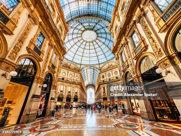 galleria vittorio emanuele ii with luxury fashion boutique stores, wide angle view, milan, italy - boutique stock pictures, royalty-free photos & images