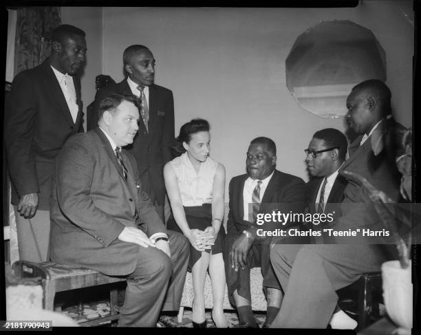 View of Democratic candidates as they talk together during a primary election campaign, Pittsburgh, Pennsylvania, April 1958. Pictured are, standing...