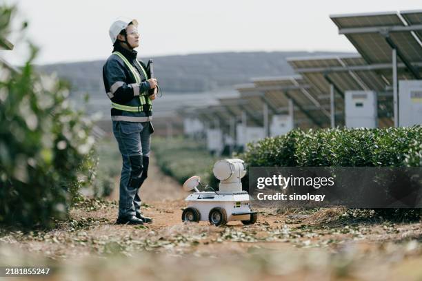 robot solar power station tablet computer - appliance manufacturing stock pictures, royalty-free photos & images