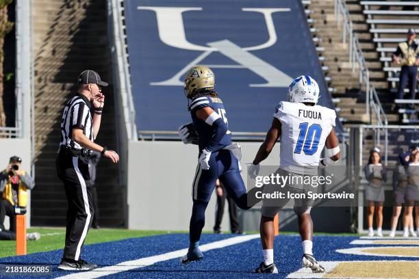 Akron Zips wide receiver Adrian Norton scores on a 2-point conversion as Buffalo Bulls safety Marcus Fuqua defends during the fourth quarter of the...