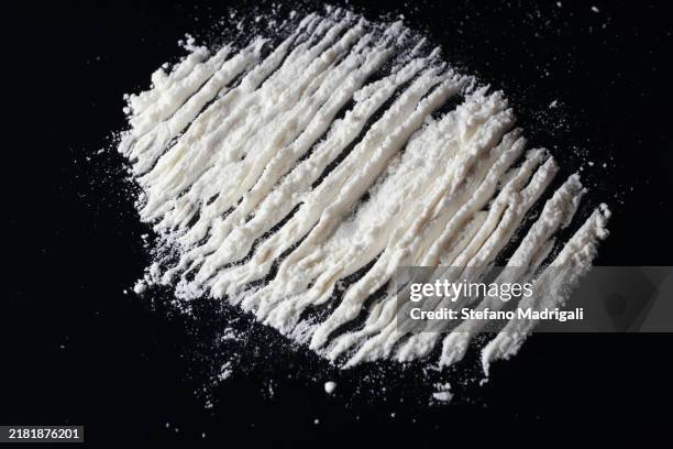 white powder with marks, dark background - pure cocaine stock pictures, royalty-free photos & images