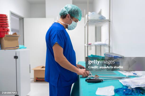 preparing surgical instruments in sterilization unit - filing tray stock pictures, royalty-free photos & images
