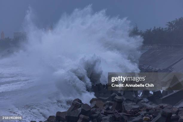 Wave crashes on concrete tetrapods outside of the Fugang Harbour before the super typhoon, Kong-rey, hits Taiwan on October 30, 2024 in Taitung,...