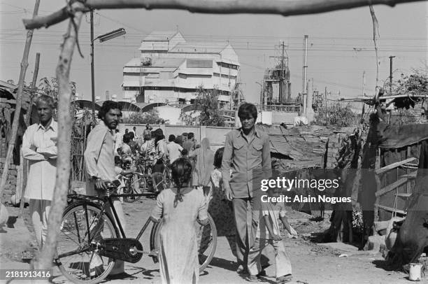 Eleven days after a cloud from the Union Carbide plant carrying methyl isocyanate gas seriously injured 20,000 people and killed 3000, the resumption...