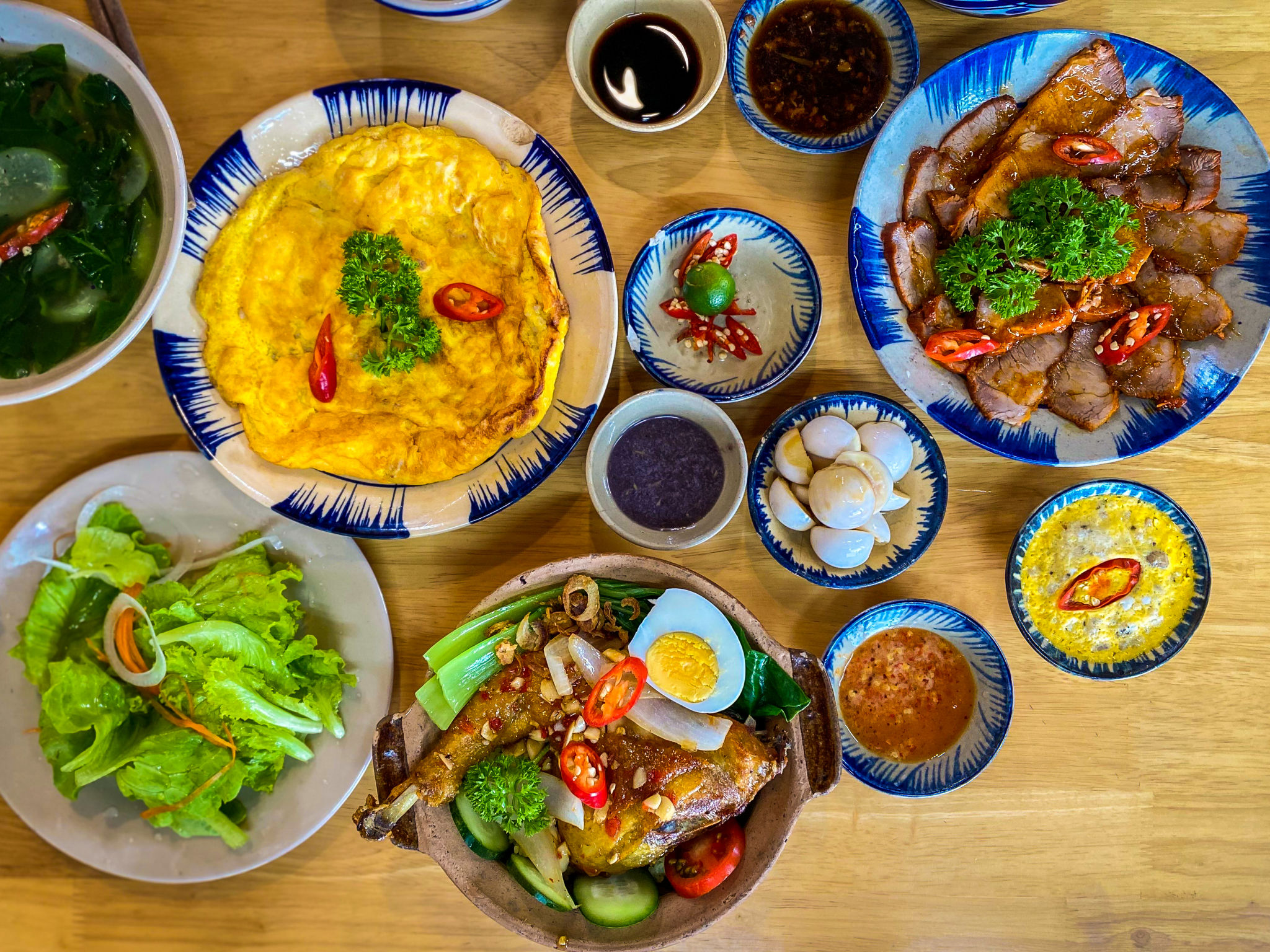 High-Quality Image of a Traditional Vietnamese Family Meal with Rustic Dishes High-Quality Image of a Traditional Vietnamese Family Meal with Rustic Dishes