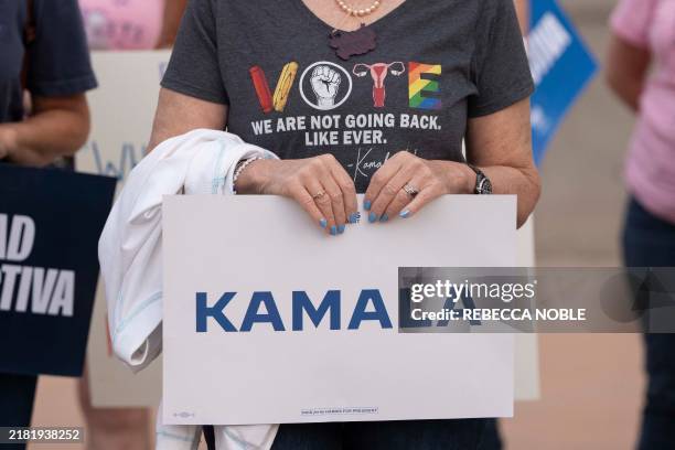 Reproductive rights supporters hold signs and share personal stories about reproductive care during the National Women's March at the Arizona State...