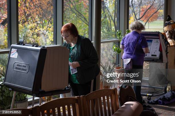Residents cast in-person absentee ballots at a polling place set up at the Warner Park recreation center on October 30, 2024 in Madison, Wisconsin....
